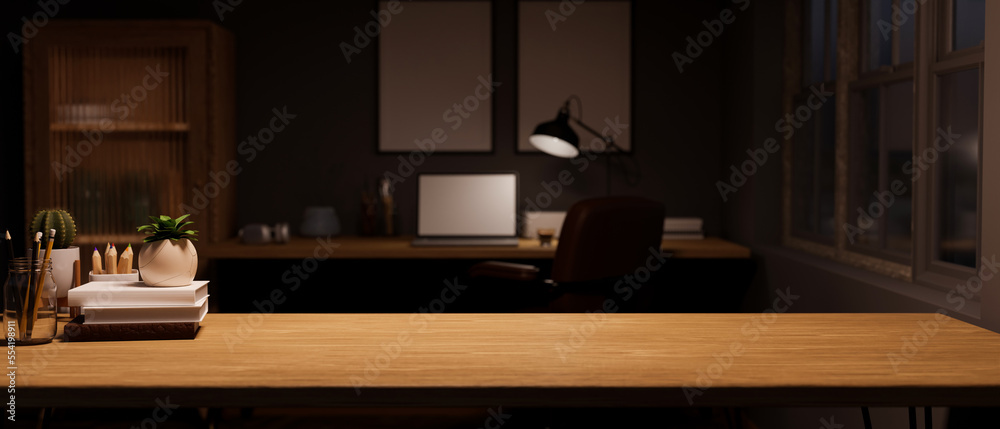 Copy space on wood tabletop with decor over blurred dark home office in the background. Copy space on wood tabletop with decor over blurred dark home office in the background.