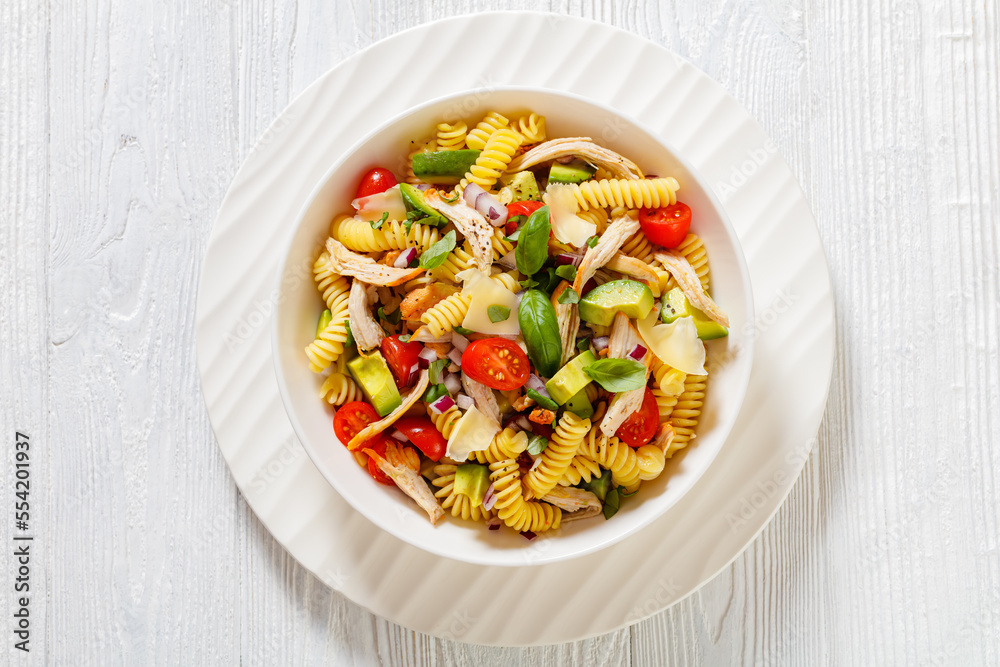 Chicken Pasta Salad with Avocado, Tomato in bowl Chicken Pasta Salad with Avocado, Tomato in bowl