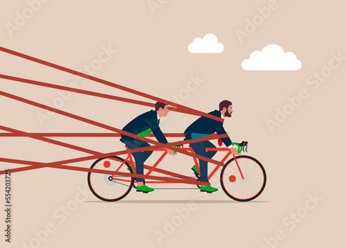 Business Team Riding Tandem Bicycle up with red tape trying to run away with full effort. Business difficulty or struggle with career obstacle, limitation and trap or challenge to overcome to success