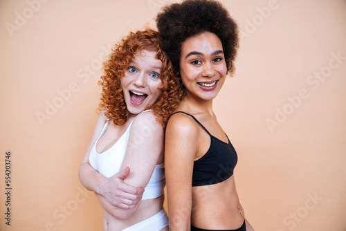 beauty image with two young women with different skin and body © oneinchpunch