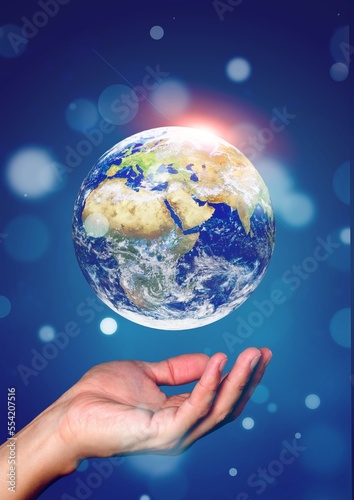 Human hold a hologram of earth globe