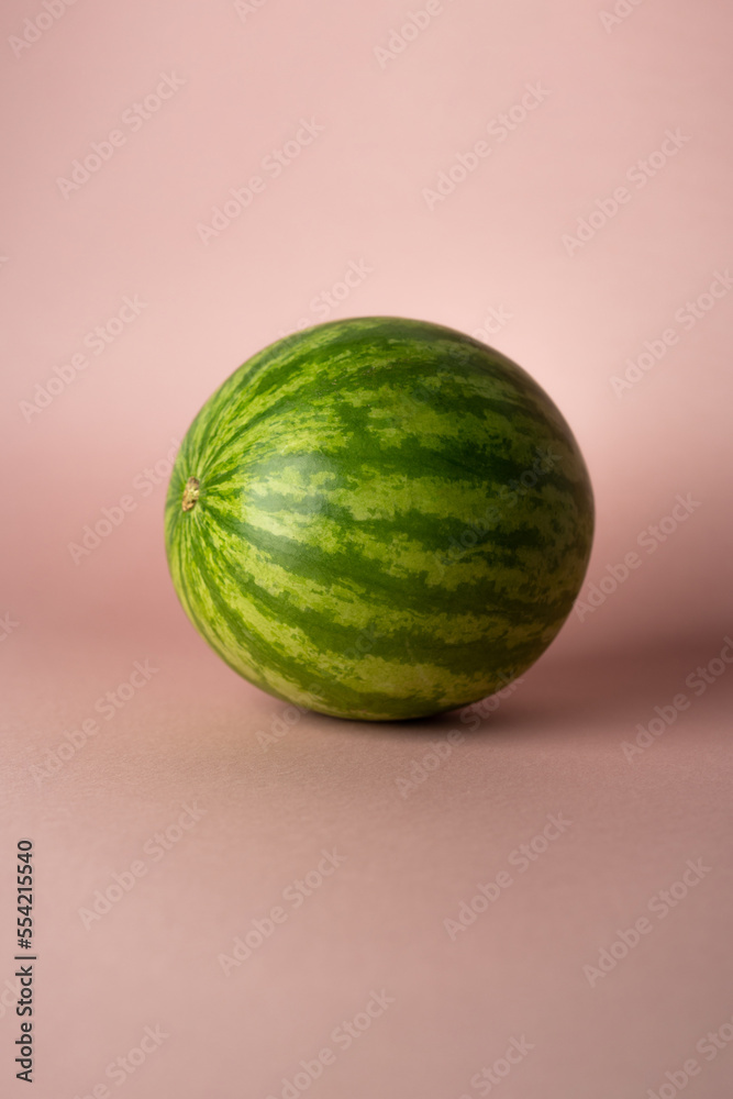 whole watermelon on rose soft background whole watermelon on rose soft background