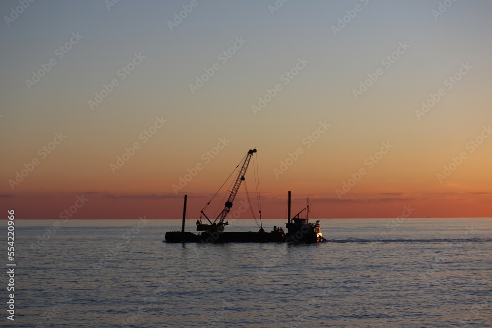 fishing boat at sunset