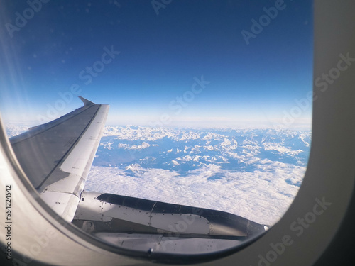 Aircraft wing and Alps from the plane window.