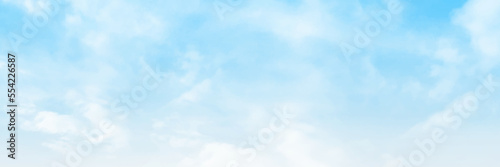 Picturesque view of blue sky with fluffy clouds. Panorama of blue sky with white clouds in clear weather on a sunny day