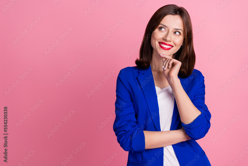 Photo of young dreamy business lady touch chin looking empty space useful information for her company isolated on pastel pink color background Photo of young dreamy business lady touch chin looking empty space useful information for her company isolated on pastel pink color background