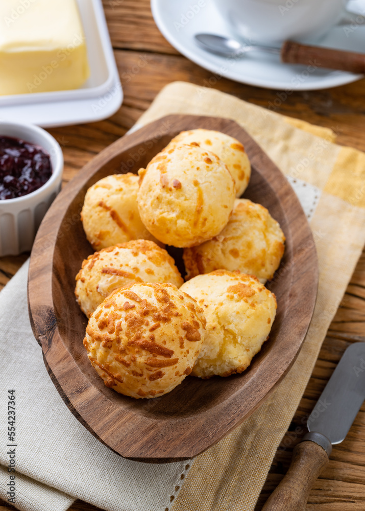 Typical brazilian cheese bun in a plate over wooden table Typical brazilian cheese bun in a plate over wooden table