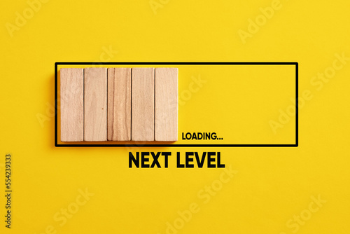 Development, improvement. Completing a task and moving forward to the next level. Next level loading bar on yellow background.