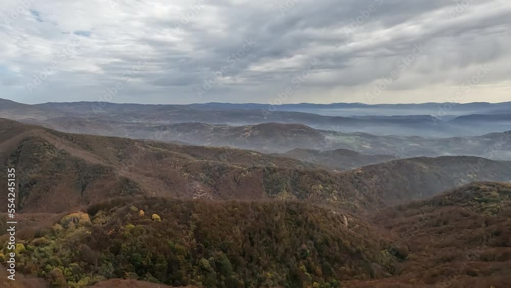 Beautiful view of misty mountain peaks in autumn season in the morning. Nature scenery, fall foggy landscape. Beautiful view of misty mountain peaks in autumn season in the morning. Nature scenery, fall foggy landscape.