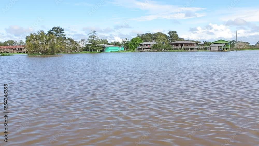 Riverside houses under the solimoes river Riverside houses under the solimoes river