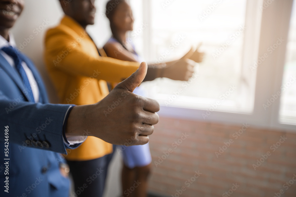 successful businessmen with hand gesture indoors	