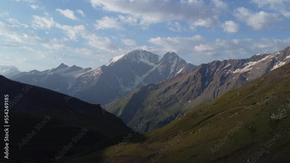 rocky mountains near Elbrus and fast-moving clouds rocky mountains near Elbrus and fast-moving clouds
