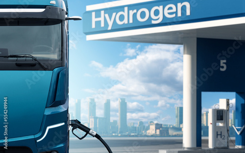 Futuristic hydrogen fuel cell truck next to filling station. Eco-friendly commercial vehicle concept photo