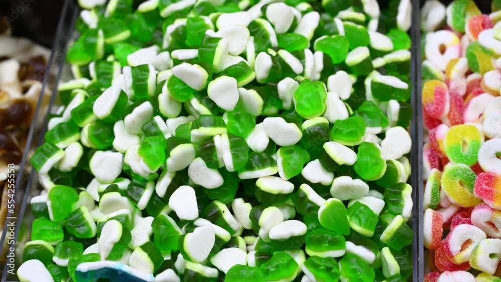 Gummy candy for sale on street market. Colorful Gummies. Fruit flavored