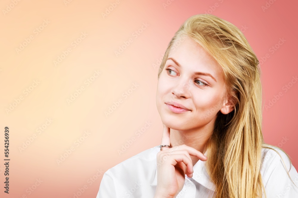 Beautiful thinking woman posing on the background Beautiful thinking woman posing on the background