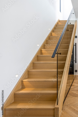 wooden staircase with light guides
