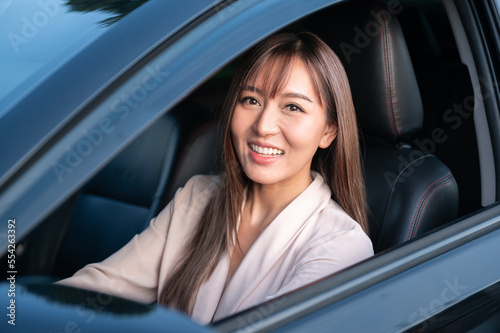 Young asian beautiful woman driving a car with fastened seatbelt © tonefotografia