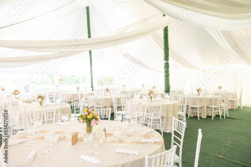 Outdoor white tent wedding reception