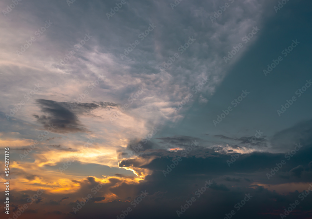 The sun's rays passing through the clouds and shining form an interesting light pattern against the sky. Space for text, Selective focus.