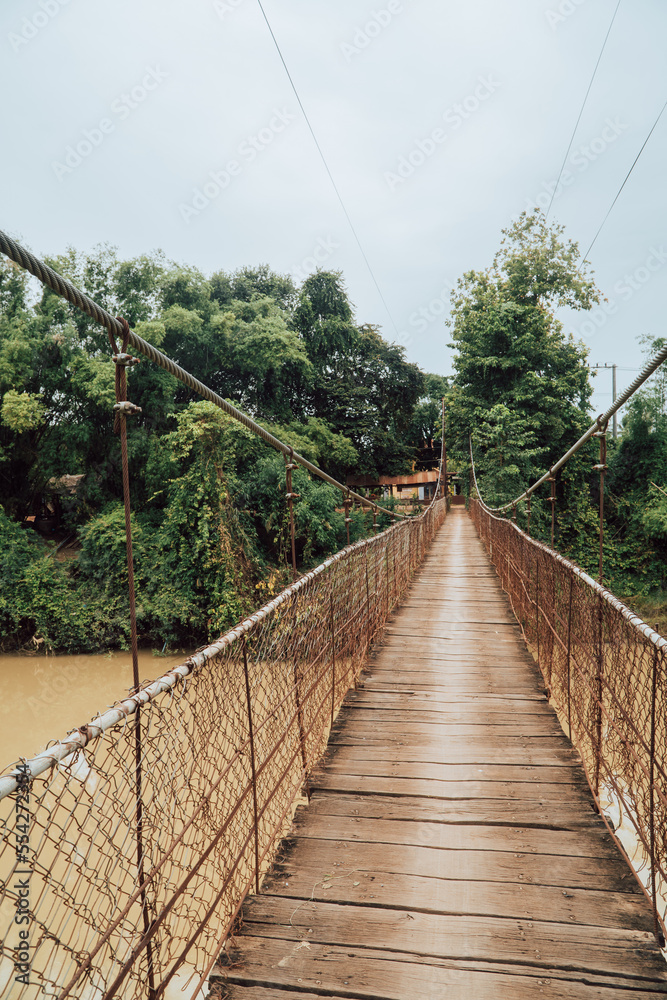 Vertical view of a rudimentary bridge over a river in rural Cambodia near Battambang