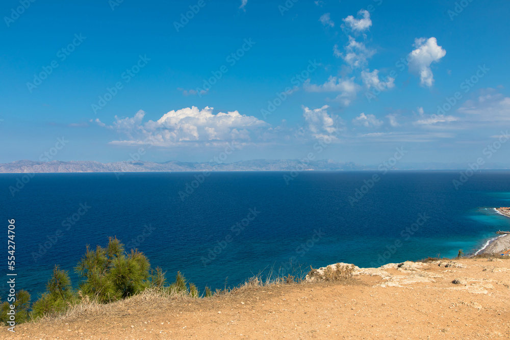 Panoramic view of the turquoise Aegean Sea with rocky coastline. In the northwestern part of the Greek island of Rhodes.
Greece Europe.
