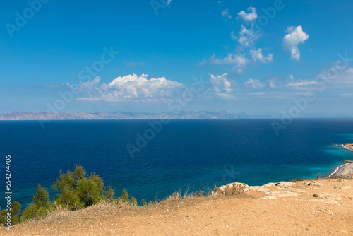 Panoramic view of the turquoise Aegean Sea with rocky coastline. In the northwestern part of the Greek island of Rhodes. Greece Europe.