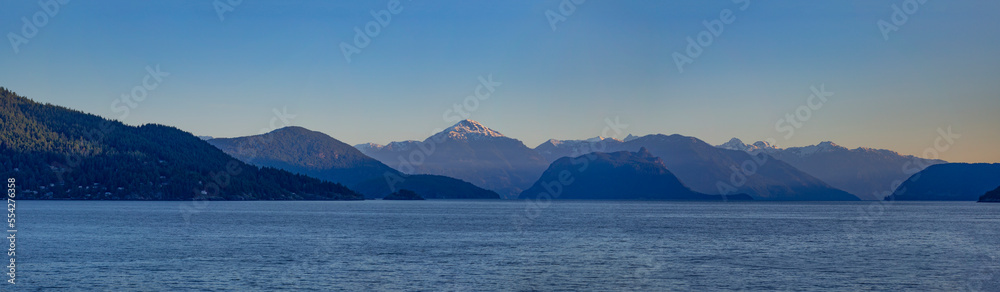 Water and mountain range at sunset viewed from Whytecliff Park, Horseshoe Bay, BC, Canada; British Columbia, Canada Water and mountain range at sunset viewed from Whytecliff Park, Horseshoe Bay, BC, Canada; British Columbia, Canada