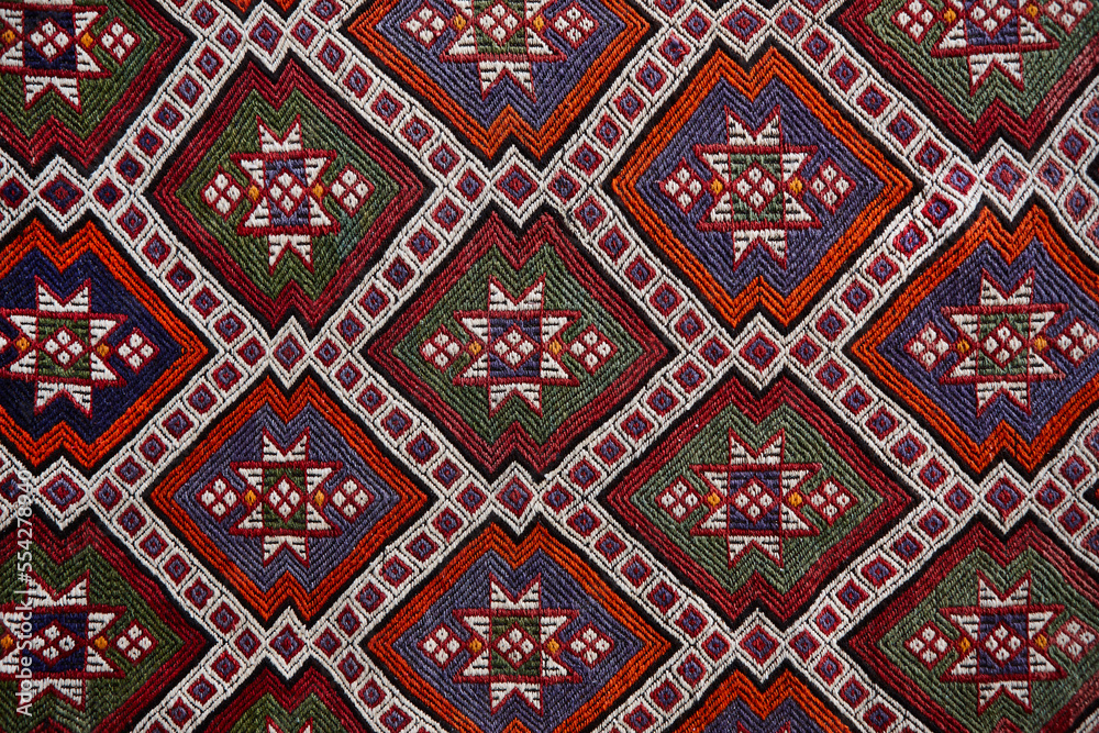 Traditional geometric oriental rug pattern detail. Colorful textile background, Turkey