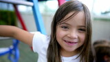 Child showing missing teeth portrait little girl teeth grow