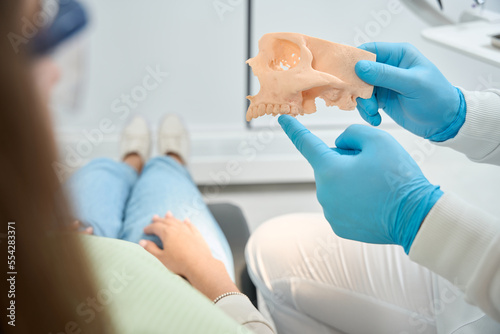 Принти на полотні Dentist telling about jawbone loss to patient