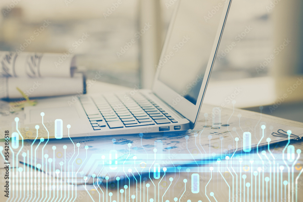 Double exposure of laptop computer and technology theme hologram. Concept of freelance work. Double exposure of laptop computer and technology theme hologram. Concept of freelance work.