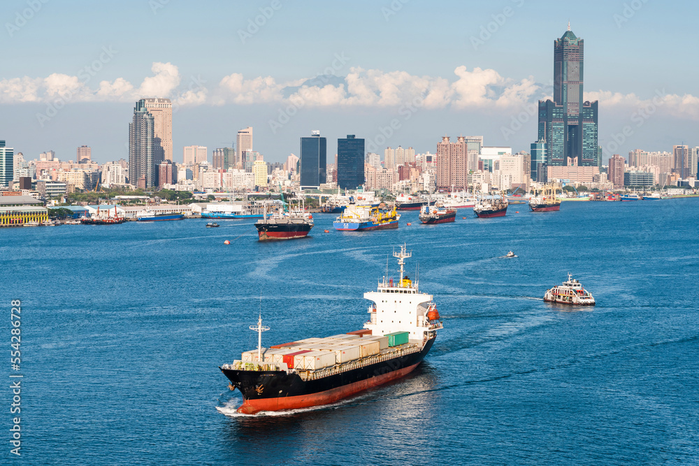 The container ship is leaving the Port of Kaohsiung, Taiwan.
