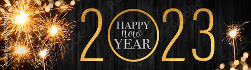 Sylvester, New Year's Eve 2023 Party, Happy New year, Fireworks, Firework background banner long- Sparklers, bokeh lights and golden year with text on black wooden texture