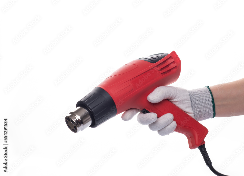 Building hair dryer, red. On an isolated white background. With a human