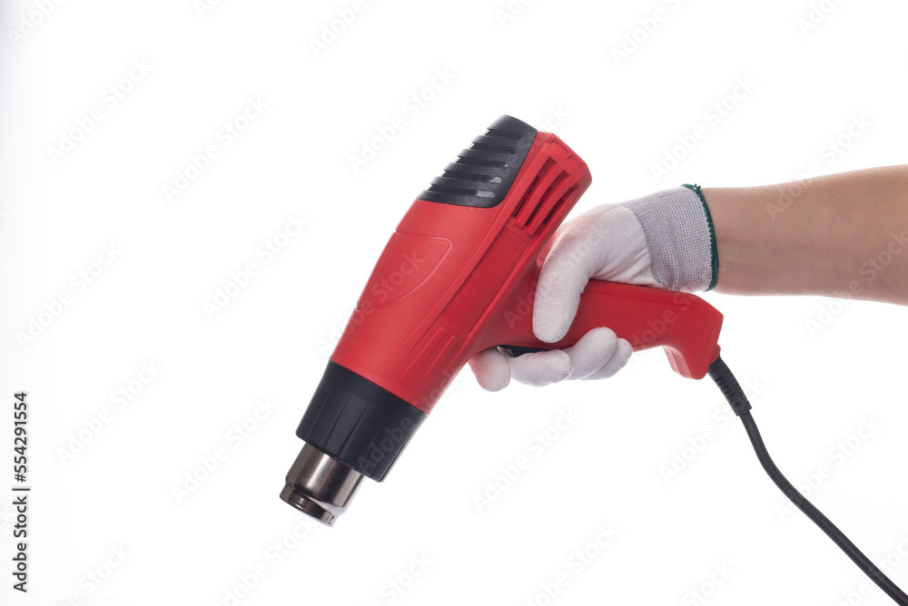 Building hair dryer, red. On an isolated white background. With a human