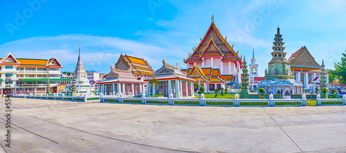 Panorama of Wat Kanlayanamit temple with Khmer styled shrines on foreground, Bangkok, Thailand photo