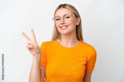 Young caucasian woman isolated on white background With glasses and doing OK sign