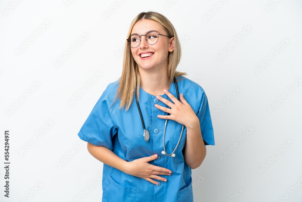 Young surgeon doctor woman isolated on white background smiling a lot Young surgeon doctor woman isolated on white background smiling a lot