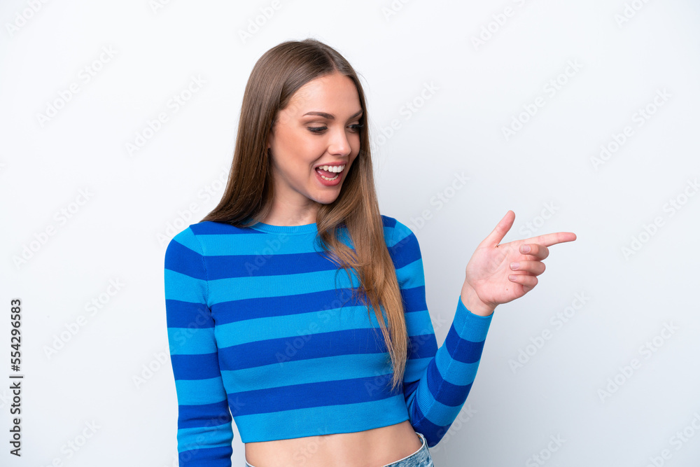 Young caucasian woman isolated on white background pointing finger to the side and presenting a product Young caucasian woman isolated on white background pointing finger to the side and presenting a product