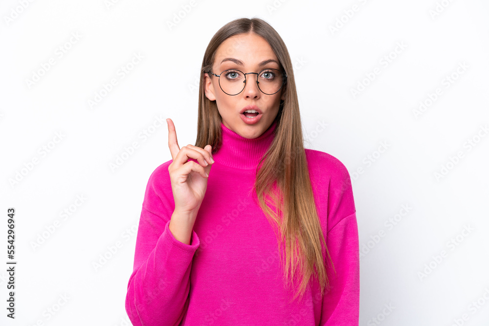 Young caucasian woman isolated on white background intending to realizes the solution while lifting a finger up Young caucasian woman isolated on white background intending to realizes the solution while lifting a finger up