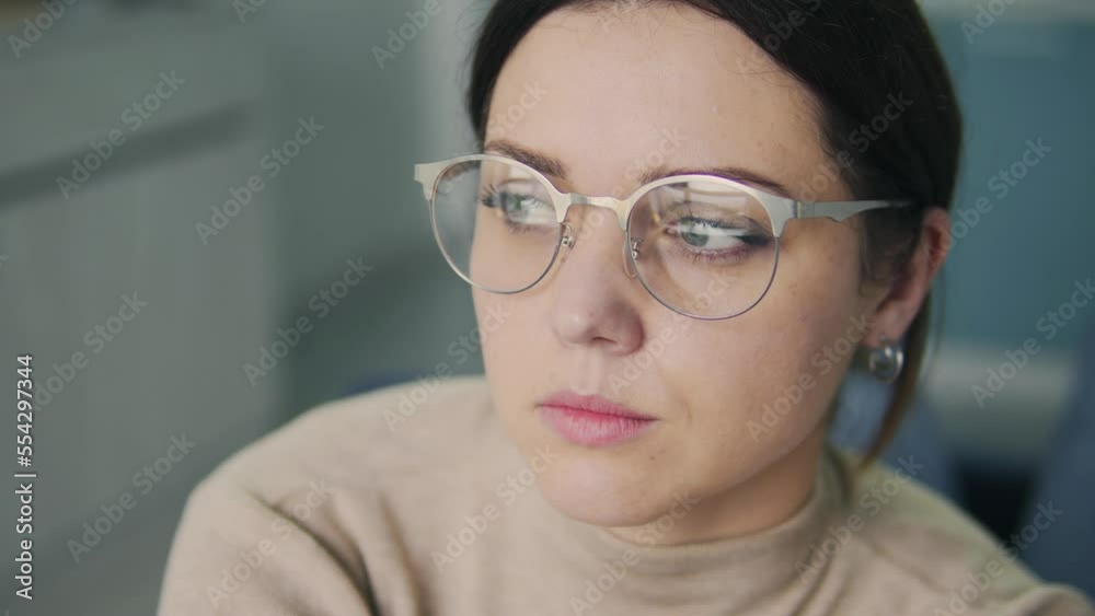 Attractive brunette woman in big fashionable eyeglasses analyzing her lifestyle and behavior sitting in psychologist office, need emotional support and some advices Attractive brunette woman in big fashionable eyeglasses analyzing her lifestyle and behavior sitting in psychologist office, need emotional support and some advices