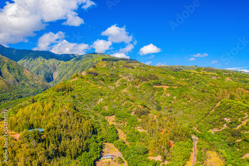 Aerial view of the mountainside and the green vegetation of Waihee Ridge in the West Maui Mountains; Maui, Hawaii, United States of America photo
