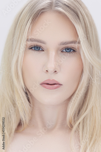 Blonde woman wearing natural make up in a lifestyle image. 