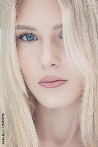 woman with blonde hair and blue eyes. 