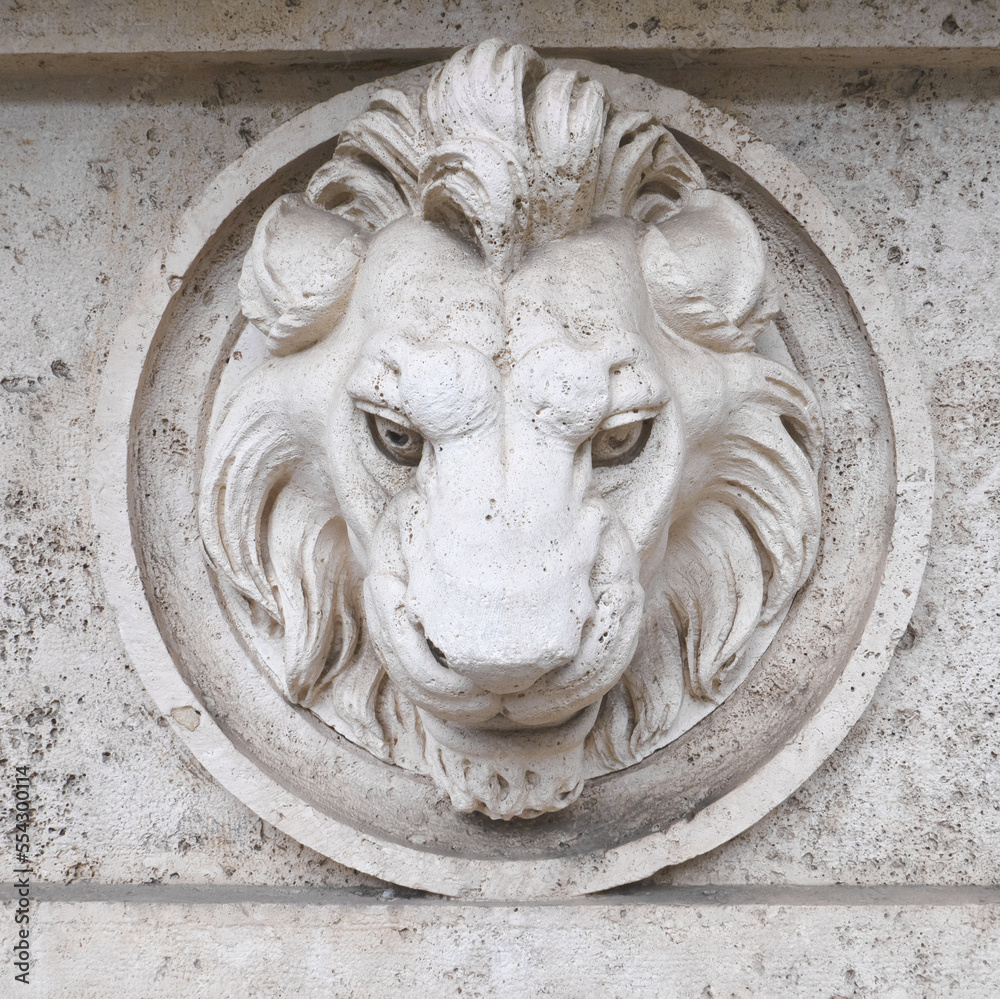 Italy, Perugia, summer 2022. Architectural element of the building: a lion placed in a circle