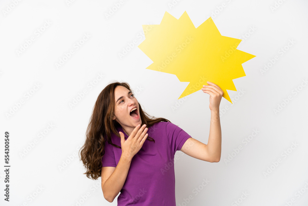 Young caucasian woman isolated on white background holding an empty speech bubble with surprised expression Young caucasian woman isolated on white background holding an empty speech bubble with surprised expression