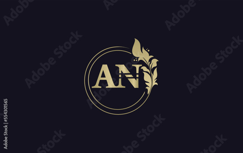 Golden leaf and circle logo design vector. Golden beauty  logo and business symbol vector design © Nasir Stock