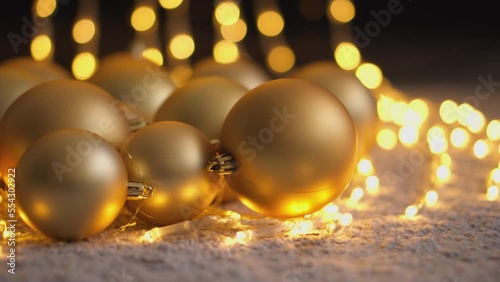 Happy New Year Christmas decorated with red and gold glass ball on bokeh twinkling lights background, garland for family holiday. Christmas tree toys and decorations. Festival mood. Positive emotions photo