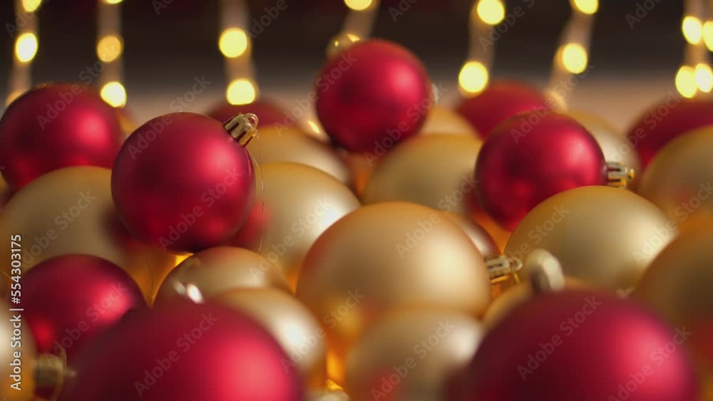 Happy New Year Christmas decorated with red and gold glass ball on bokeh twinkling lights background, garland for family holiday. Christmas tree toys and decorations. Festival mood. Positive emotions Happy New Year Christmas decorated with red and gold glass ball on bokeh twinkling lights background, garland for family holiday. Christmas tree toys and decorations. Festival mood. Positive emotions