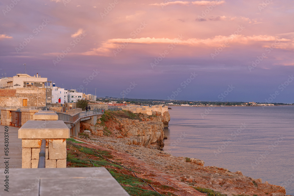 Sunrise colours over Polignano a Mare resort in Puglia, Italy, Europe
